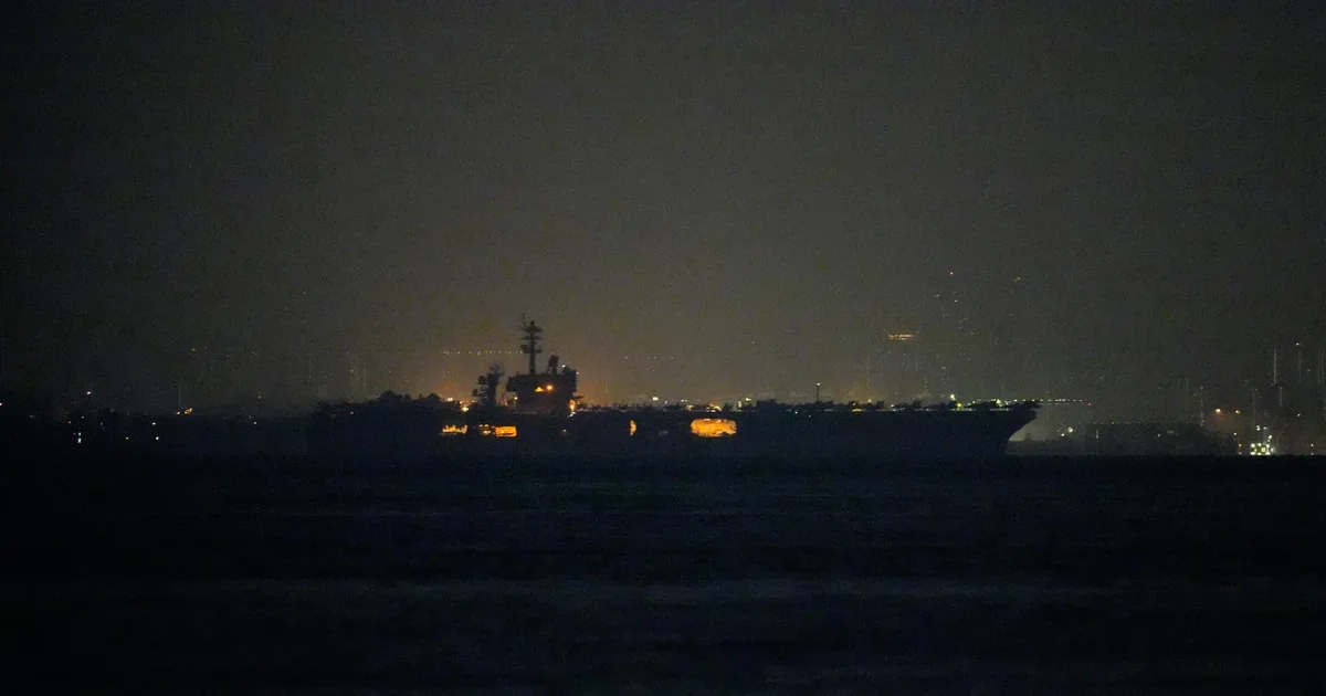 USS Lincoln sails past Singapore on its way from the Middle East after grueling 9-month deployment